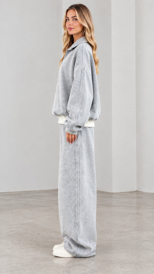 Side view of model wearing washed grey 2-piece lounge set with relaxed wide-leg trousers
