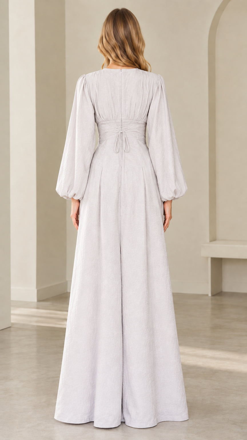 Back view of dove grey jumpsuit showing lace up corset tie back detail