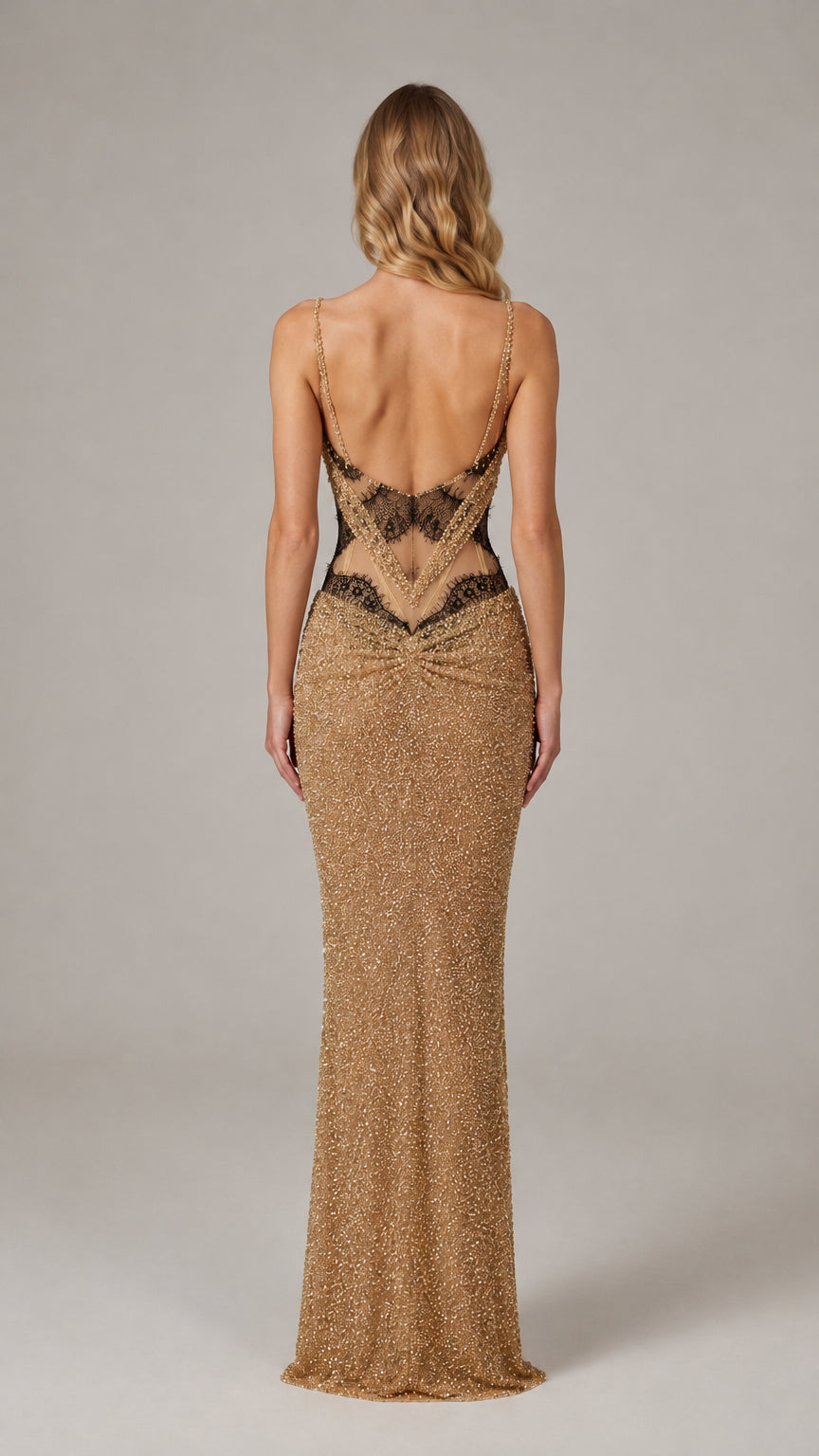 Back view of gold beaded evening gown highlighting low back and lace accents