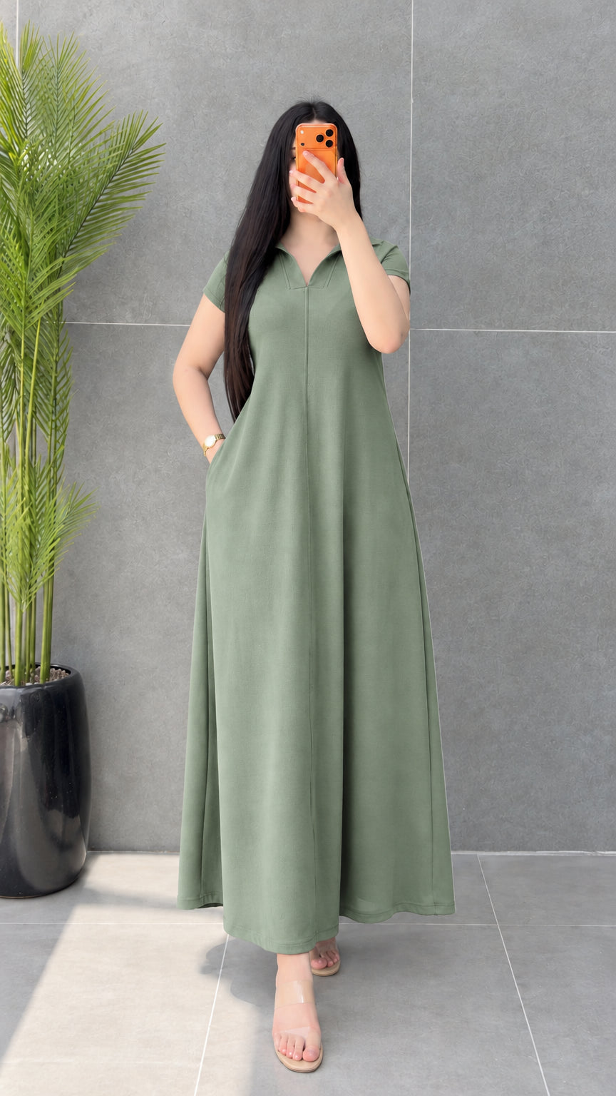 Front view of woman wearing Sage Green short sleeve A-line maxi dress with pocket