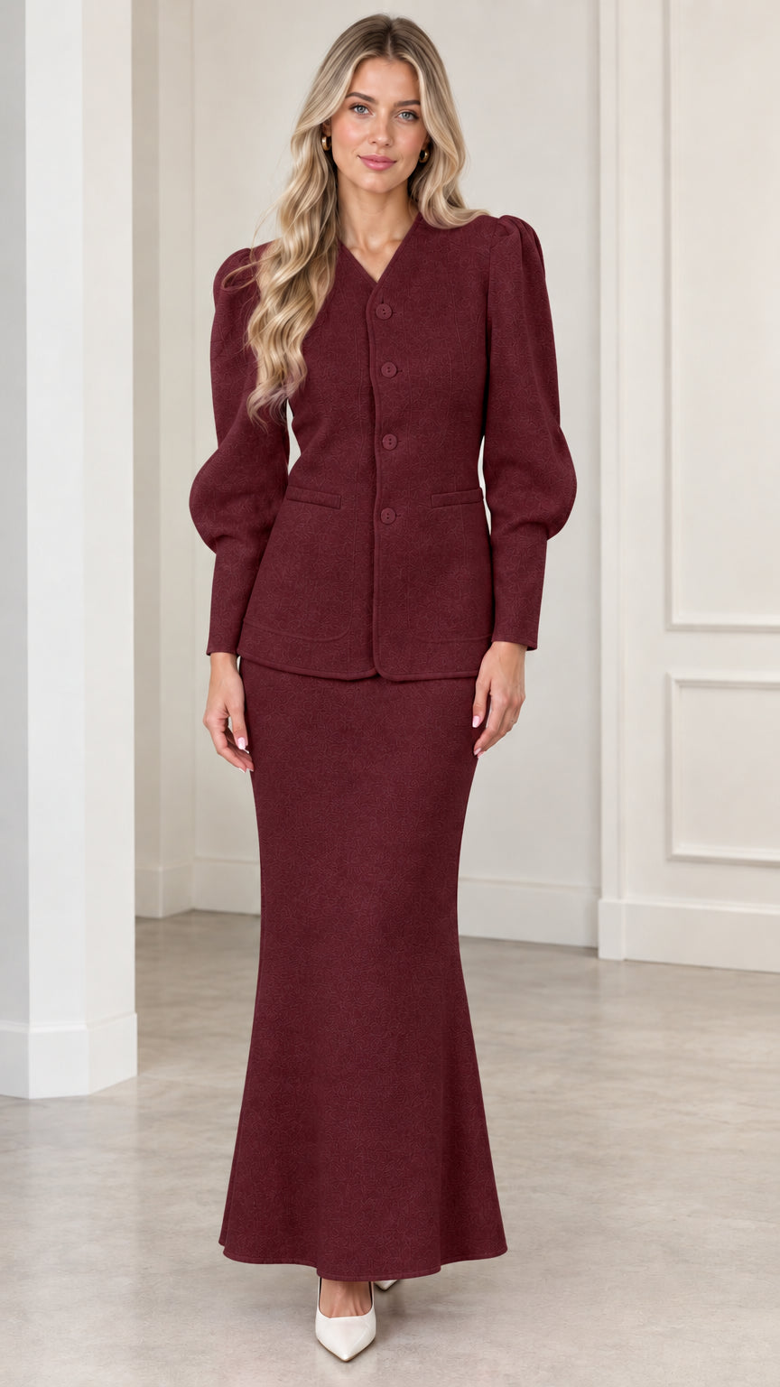 Front view of woman wearing Burgundy puff sleeve jacket and maxi skirt set