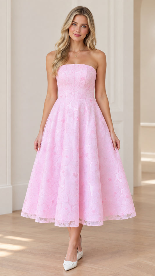 Front view of woman wearing strapless pink floral lace A-line midi dress