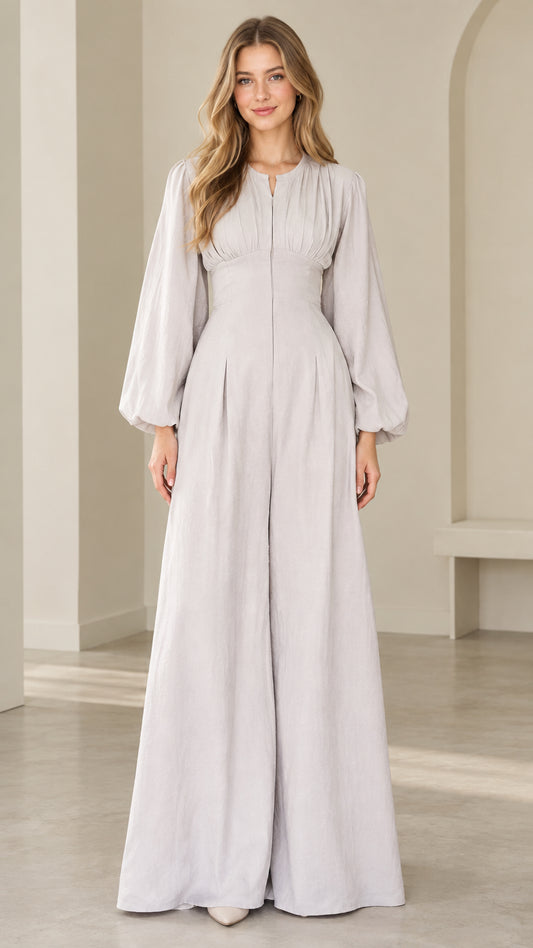Front view of model wearing dove grey lantern sleeve wide leg jumpsuit