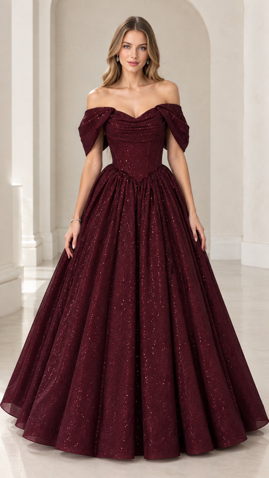 Front view of model wearing burgundy off-the-shoulder glitter ball gown