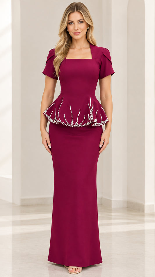 Front view of model wearing Burgundy square neck peplum maxi evening gown with beaded waist trim