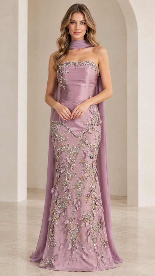 Front view of model wearing mauve strapless beaded mermaid evening gown with neck scarf cape