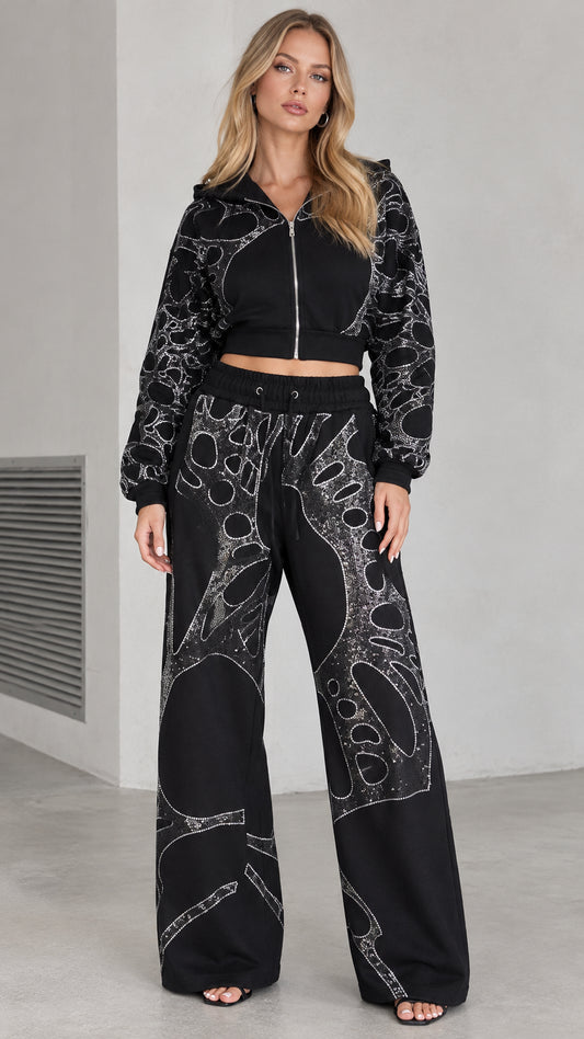 Front full view of woman wearing black rhinestone cropped hoodie and wide leg pants set