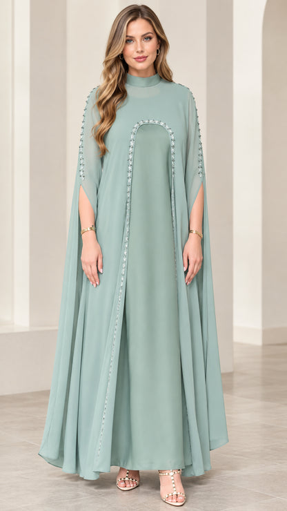 Full front view of sage green mock neck maxi dress with split cape sleeves and floral bead trim