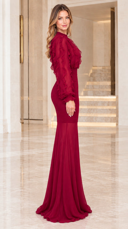 Side angle view of model in Wine Red floor-length smocked evening gown