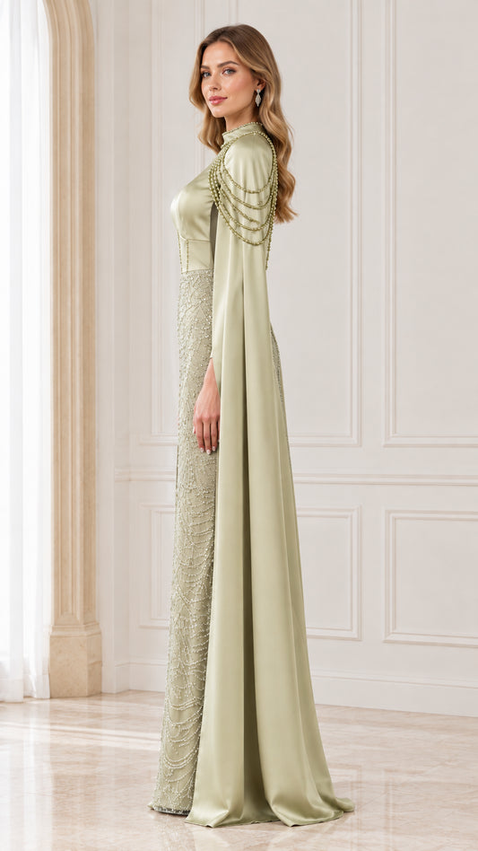 Side angle view of model wearing sage green cape sleeve beaded evening dress