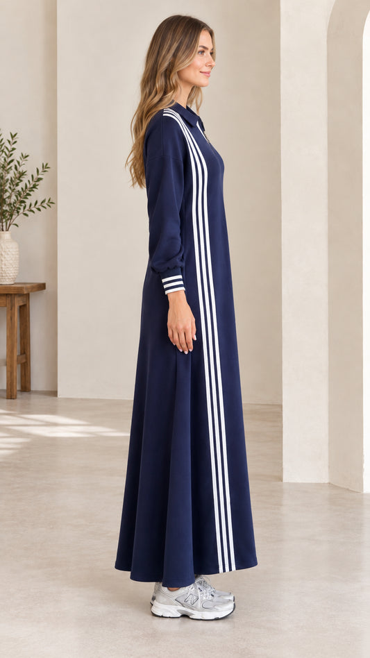 Side profile view of navy blue long sleeve striped maxi track dress