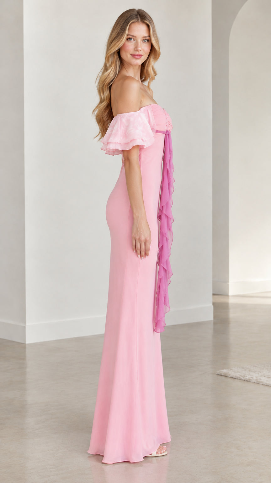 Side profile of model wearing pink ruffle sleeve floor-length formal dress