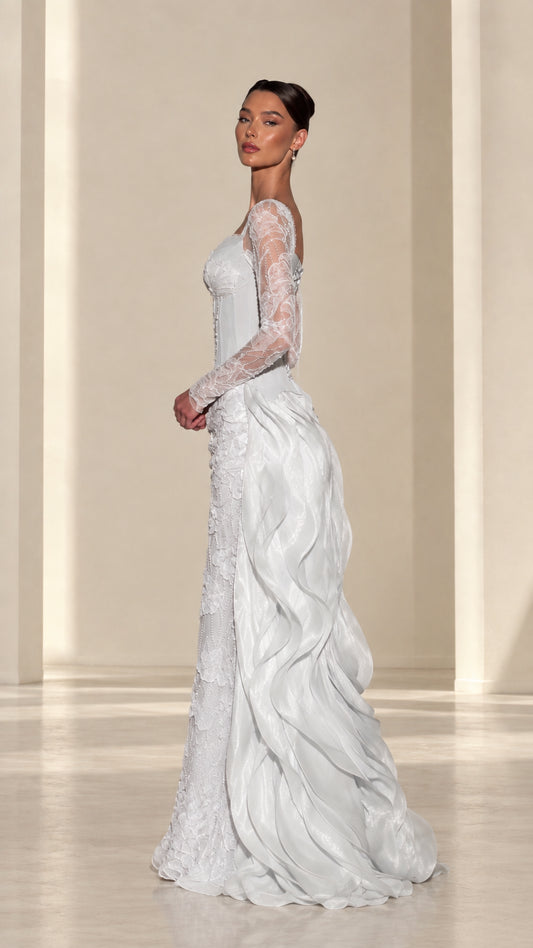 Side profile of ice blue formal corset dress showing cascading ruffle train