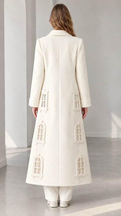 Back view of ivory window appliqué longline winter coat