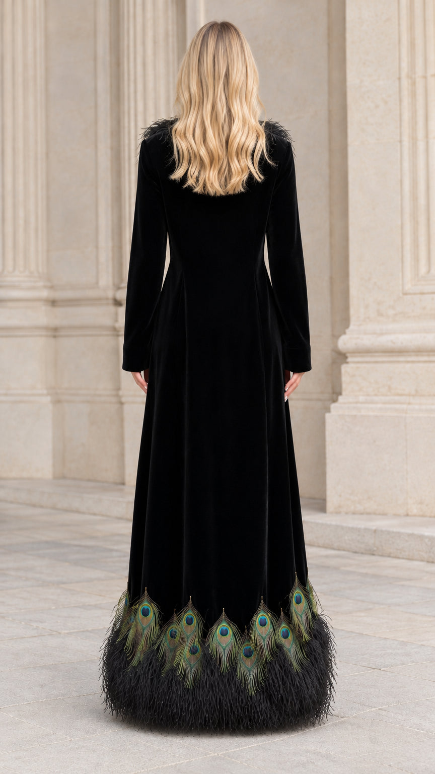 Back view of black velvet maxi coat showcasing tailored drape