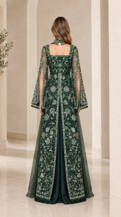 Back view of emerald green evening dress featuring square back neckline and floor-length train overlay