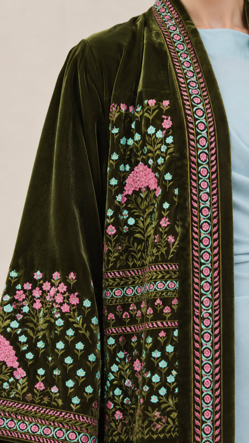 Close-up detail of floral and border embroidery on Dark Green velvet sleeve