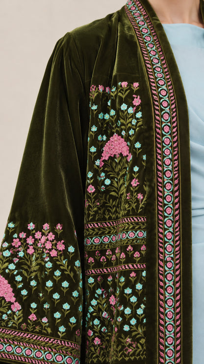 Close-up detail of floral and border embroidery on Dark Green velvet sleeve