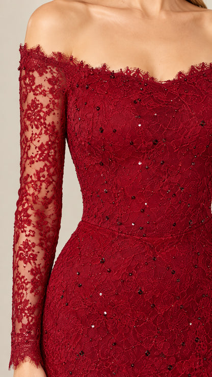 Detailed close-up of burgundy sequined lace fabric and scalloped off-the-shoulder neckline