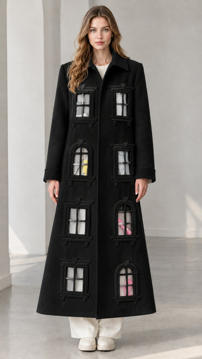 Full-length view of black architectural window appliqué longline overcoat