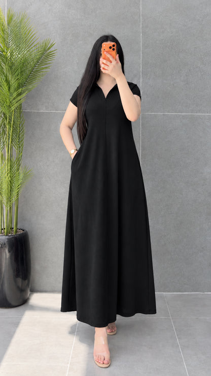 Front view of woman wearing classic Black short sleeve polo maxi dress