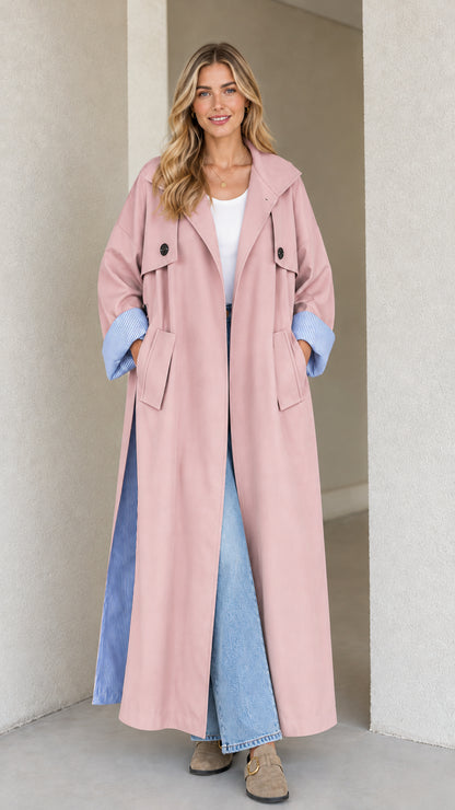Front view of dusty pink maxi trench coat with contrast striped accents