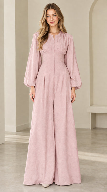 Model wearing dusty pink long sleeve palazzo jumpsuit