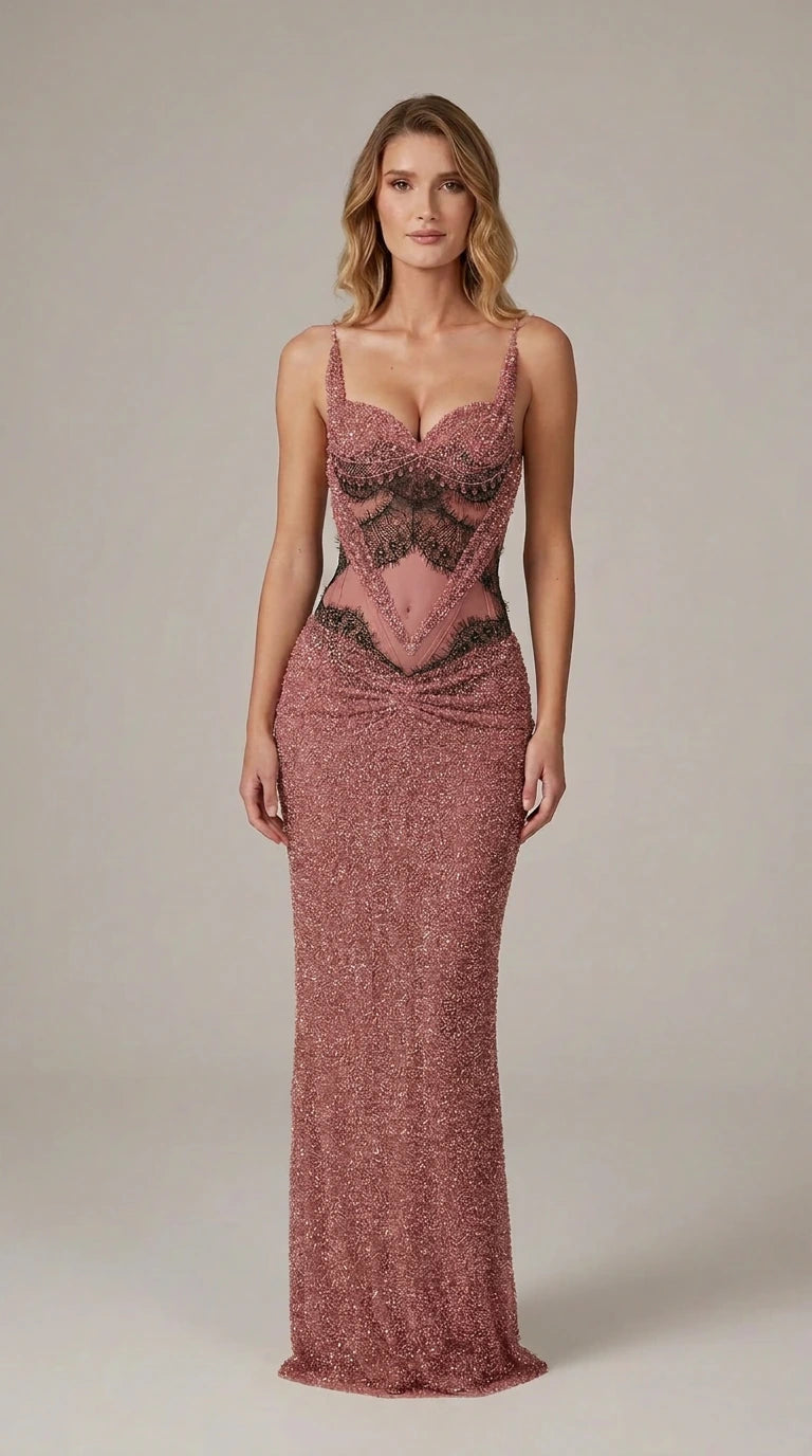 Model wearing dusty rose pink beaded formal maxi dress with lace waist insert