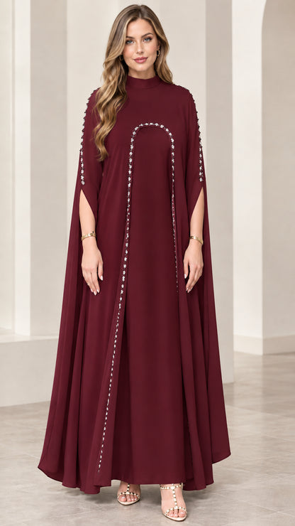 Full front view of burgundy wine red embellished cape maxi dress