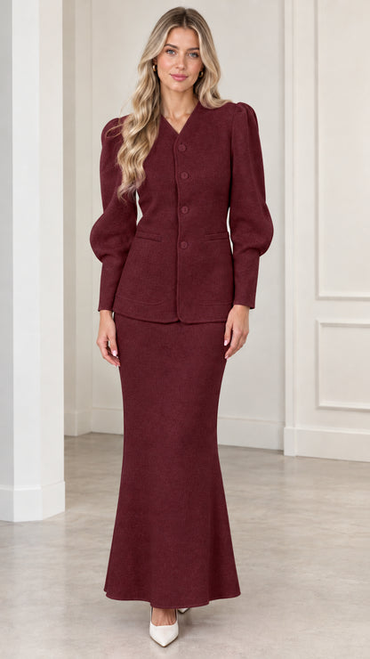 Front view of woman wearing Burgundy puff sleeve jacket and maxi skirt set