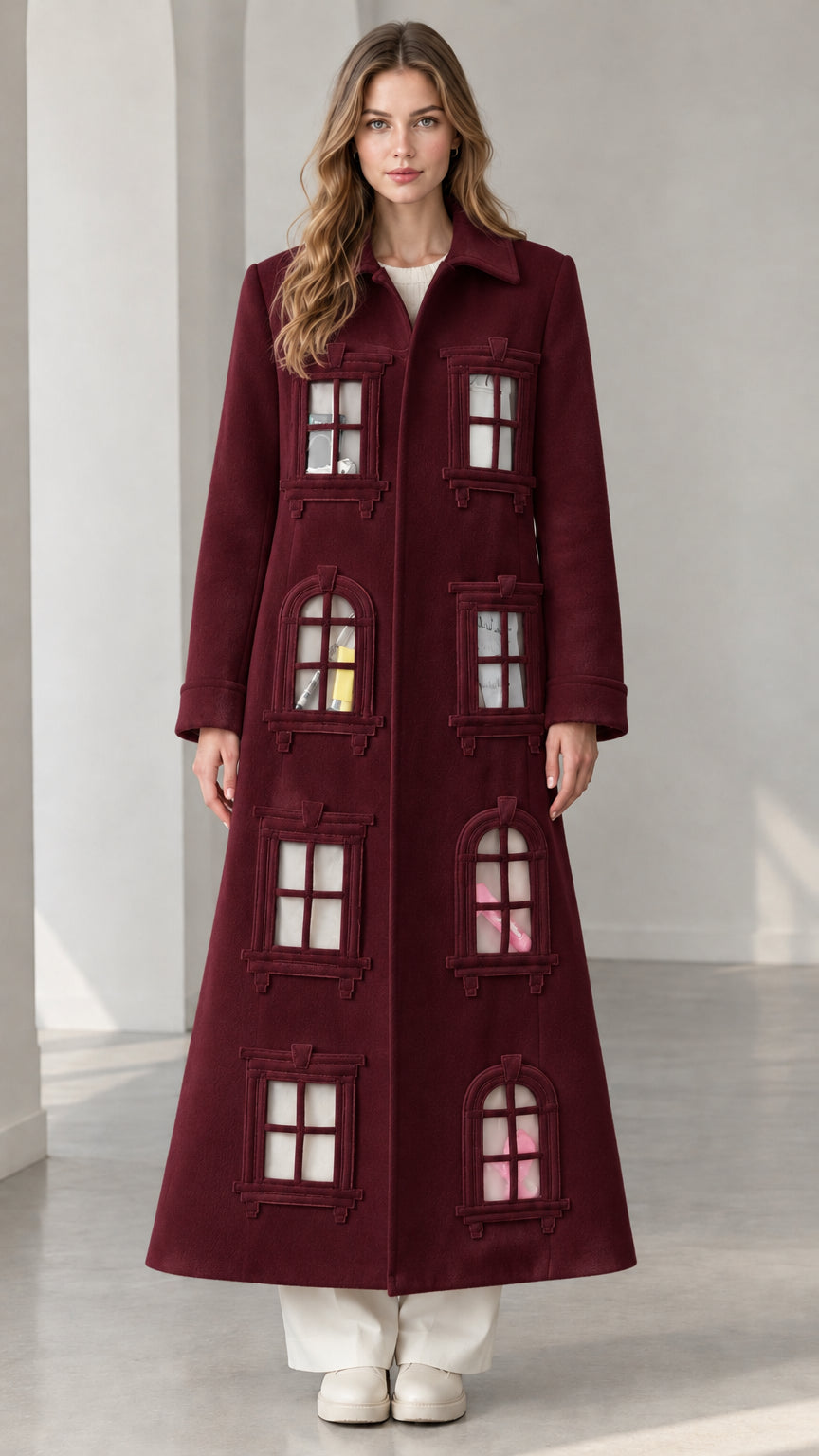 Full-length view of deep burgundy architectural window appliqué maxi coat
